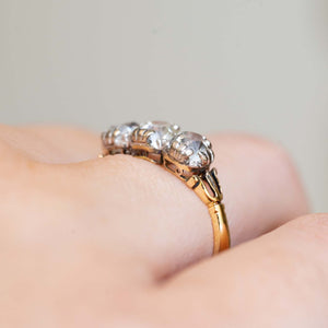 Side view of the raised diamond settings and carved shoulders