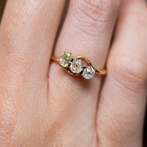 A close-up of three antique diamonds in an Art Nouveau engagement ring