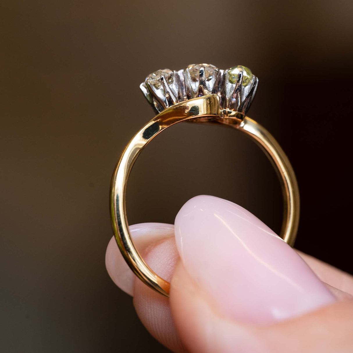 Side profile showing the open gallery and three diamond settings