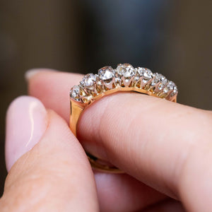 Side profile showing the ornate gallery of an Edwardian diamond ring