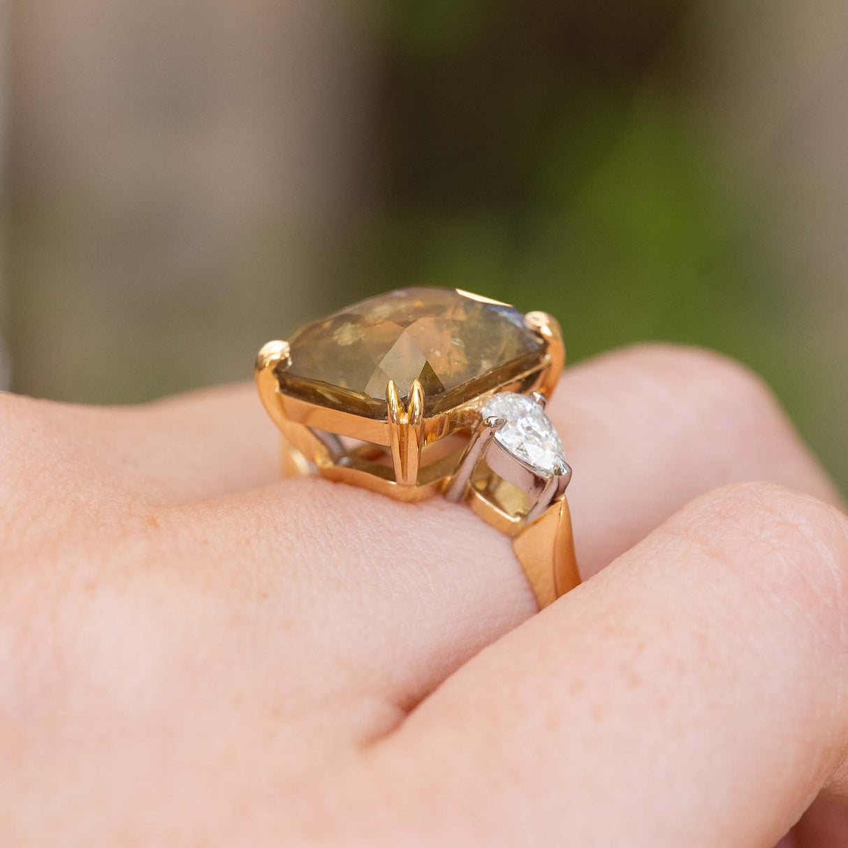 Side profile of a vintage-inspired brown sapphire and diamond ring