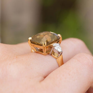 Side profile of a vintage-inspired brown sapphire and diamond ring