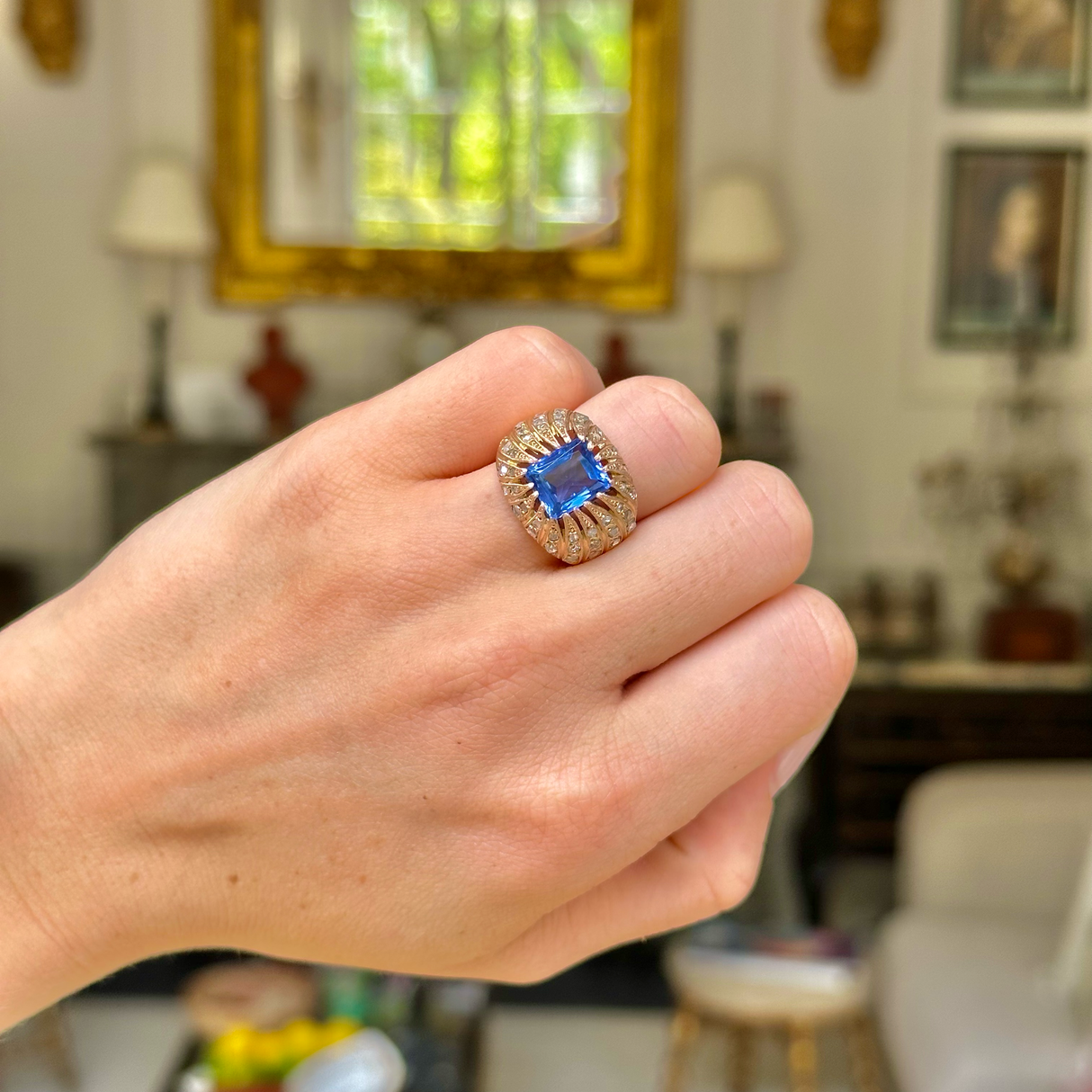 Vintage ceylon sapphire and diamond ring worn on closed hand. 