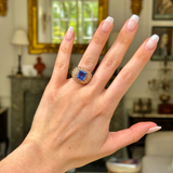 Vintage ceylon sapphire and diamond ring worn on hand. 