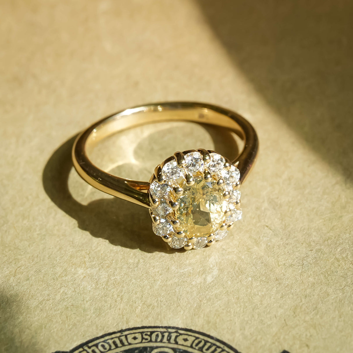Yellow sapphire and diamond cluster engagement ring with vintage style setting