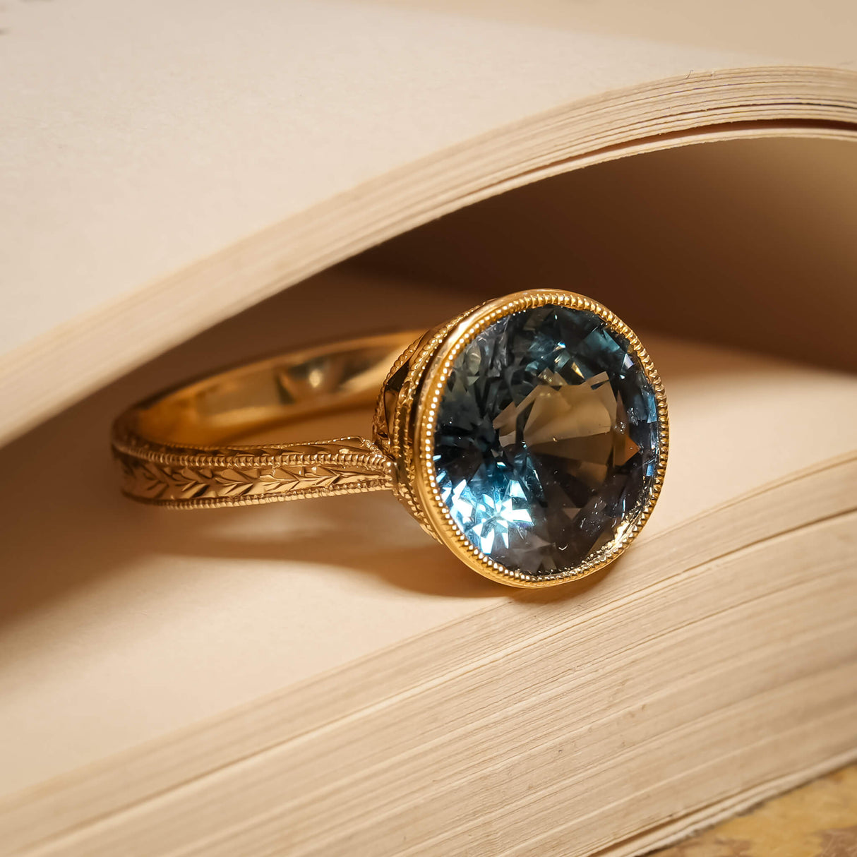 5.70ct Caribbean sapphire solitaire ring with detailed gold band