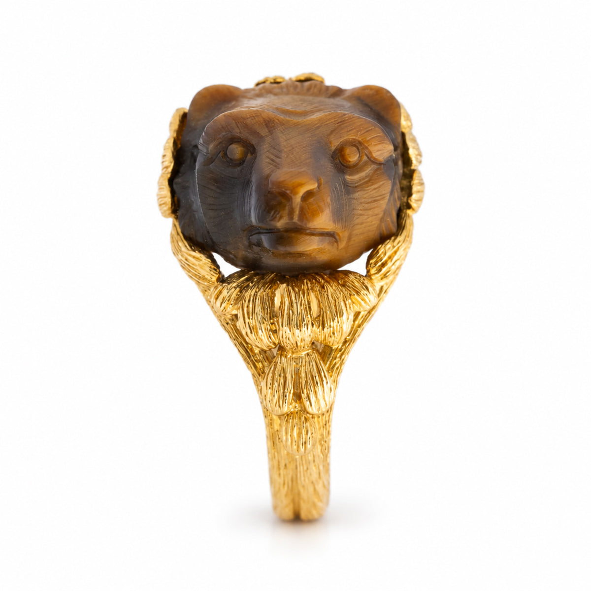 A vintage, 1980's French tiger's eye honey bear ring in yellow gold shown from profile to show bear face.