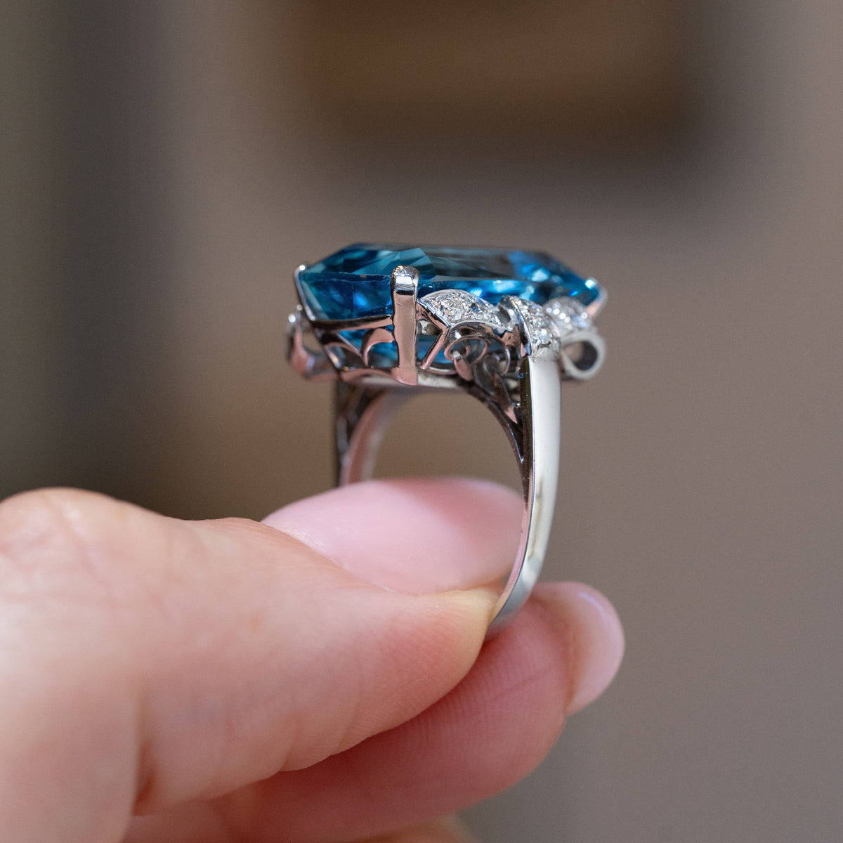 Side profile of the Art Deco aquamarine ring, revealing the elevated gemstone setting and intricate platinum gallery.