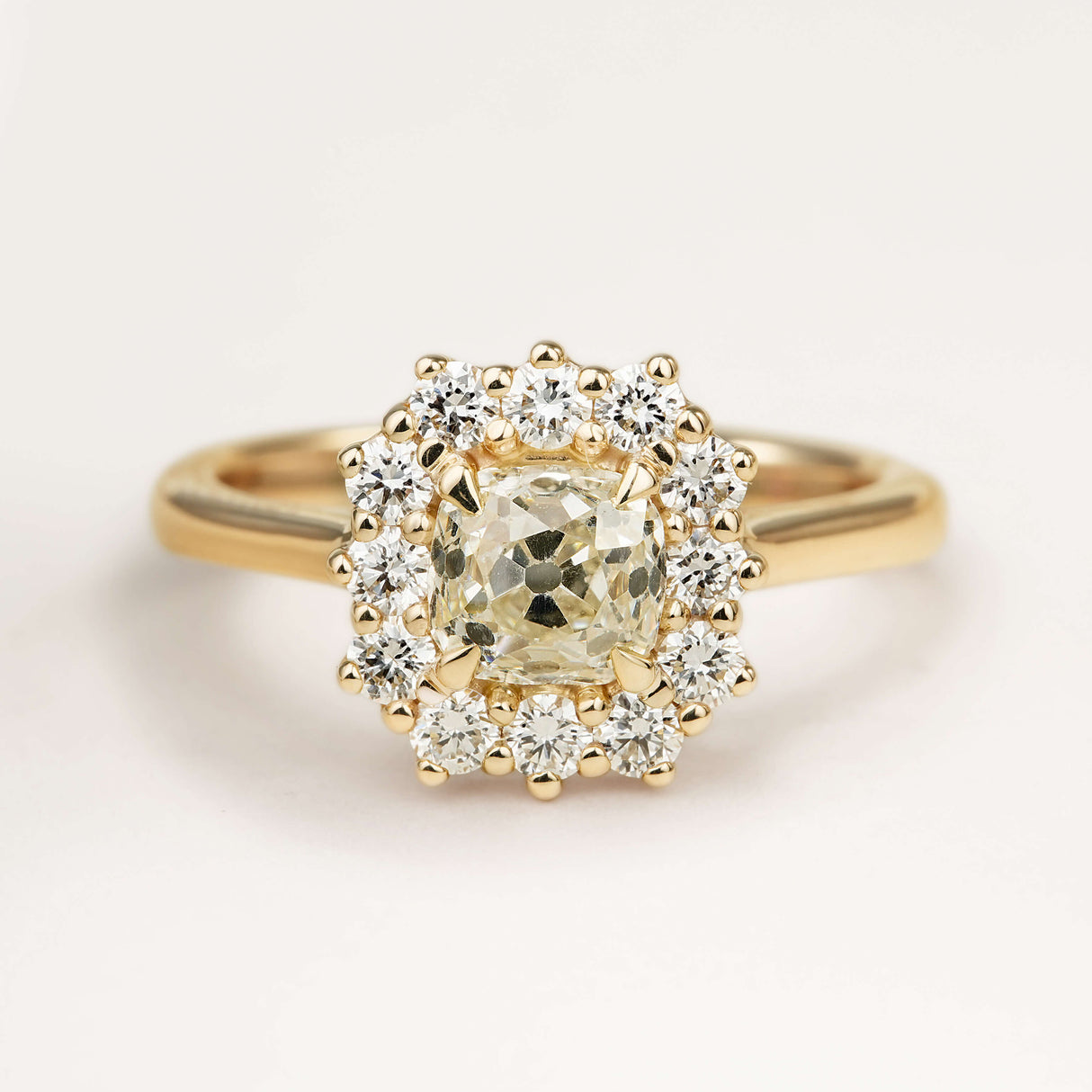 Old-mine cushion diamond cluster engagement ring
