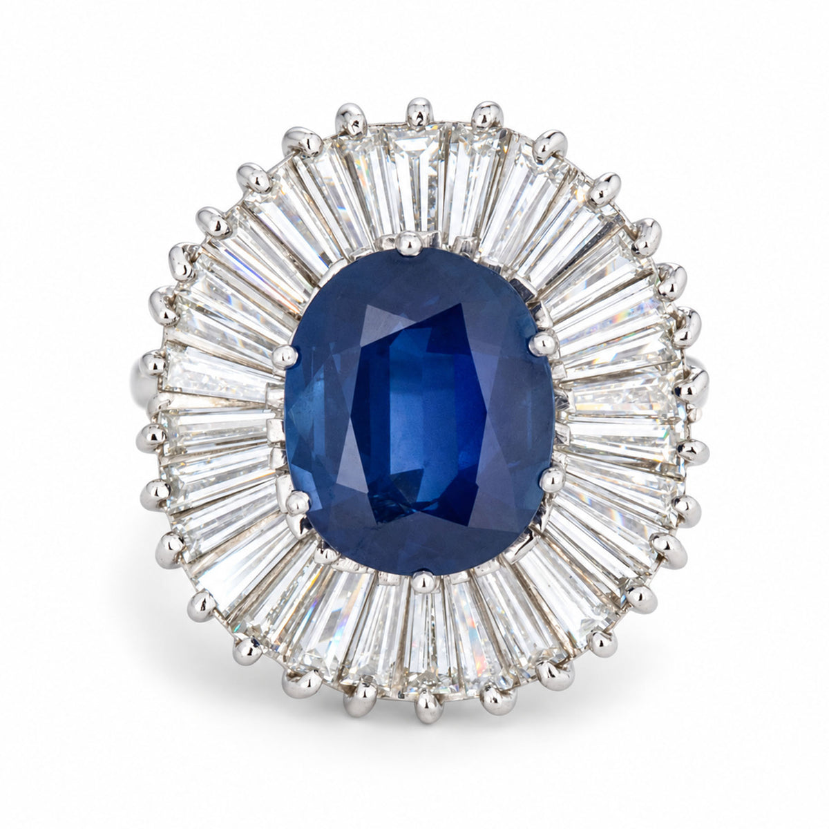 Front view of a vintage 1950s blue sapphire and baguette-cut diamond ballerina cluster cocktail ring in 18ct white gold.