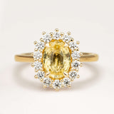 Sri Lankan yellow sapphire and diamond cluster engagement ring
