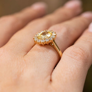 Antique-inspired, yellow sapphire and diamond cluster engagement ring