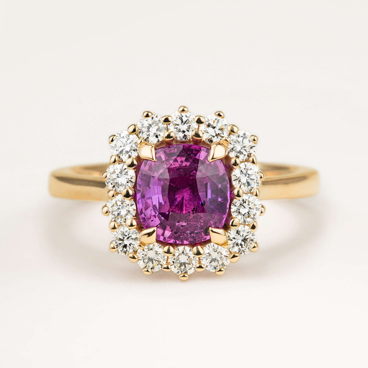Cushion-cut pink sapphire and diamond cluster engagement ring