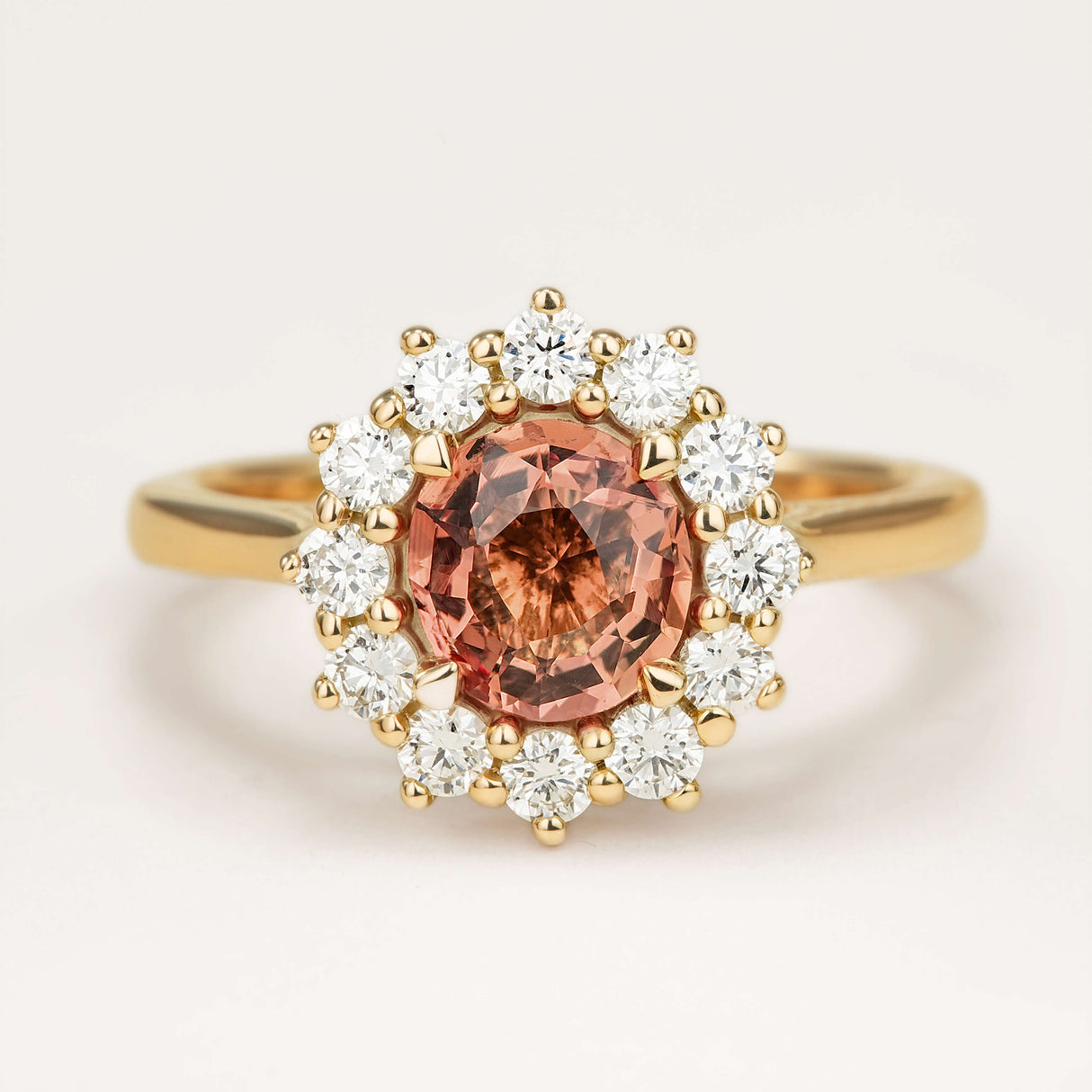Burnt orange sapphire and diamond cluster engagement ring