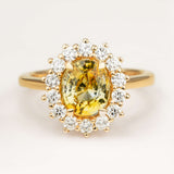 2.11ct oval-cut yellow sapphire and diamond cluster engagement ring