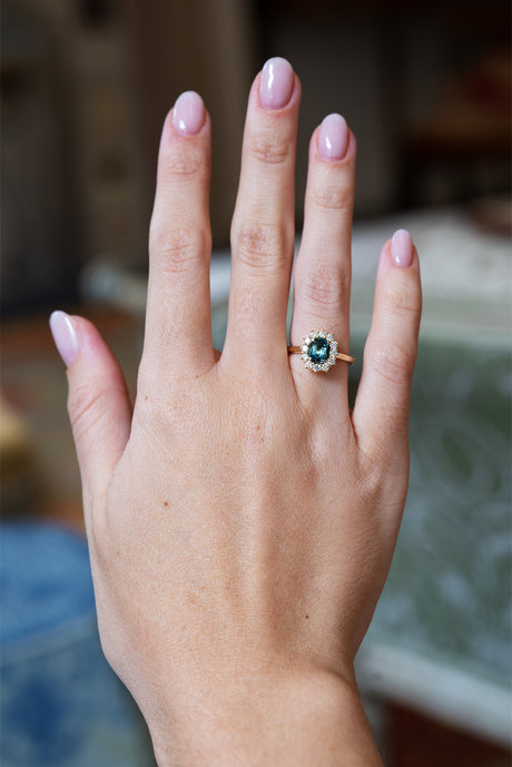 Green sapphire and diamond cluster engagement ring
