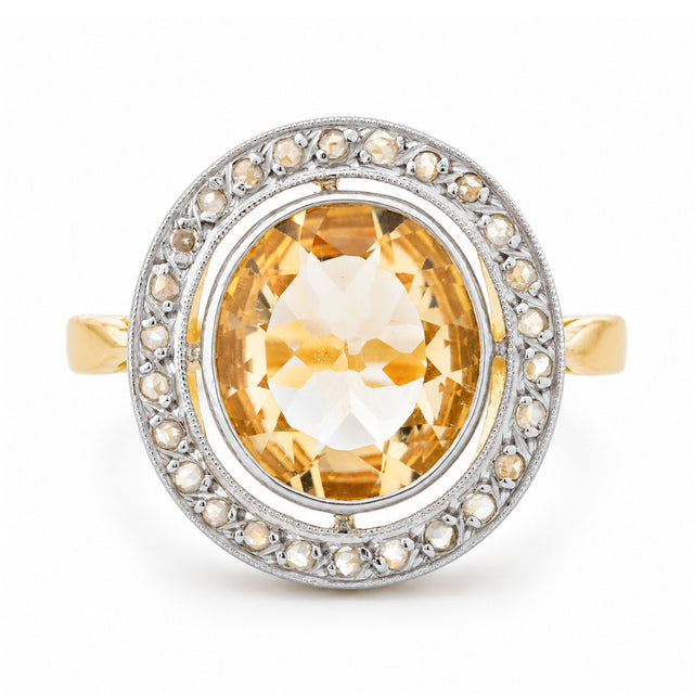 Front view of an antique French Belle Époque yellow citrine and rose-cut diamond cluster engagement ring in yellow gold and platinum.