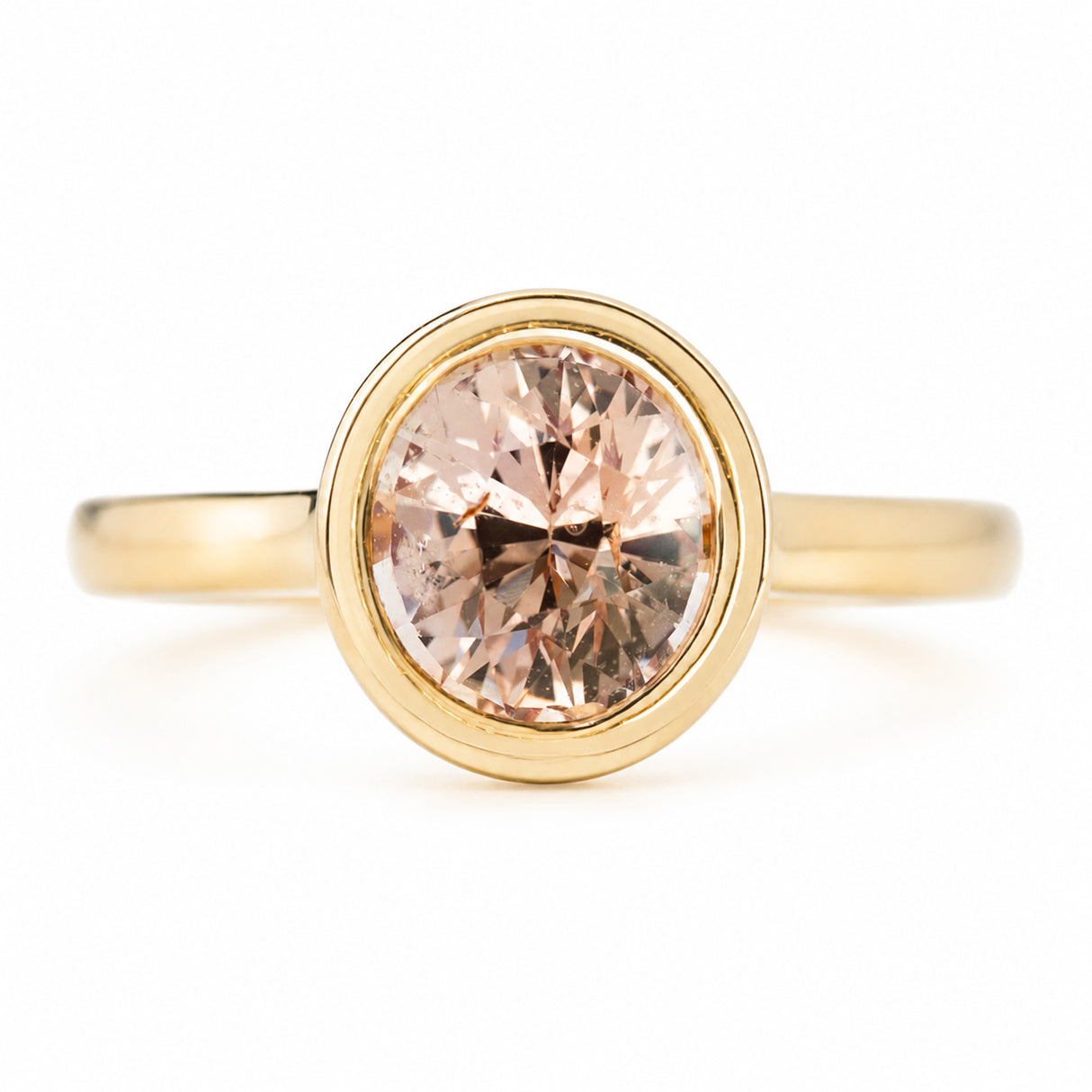 Antique-inspired, peach sapphire solitaire engagement ring