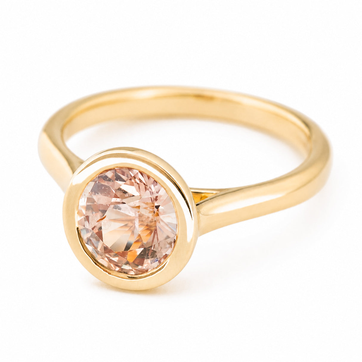 Antique-inspired, peach sapphire solitaire engagement ring