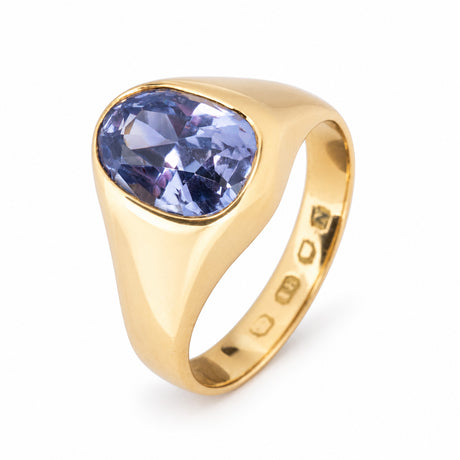 Raised studio view of the Victorian sapphire ring, showcasing its substantial tapered gold band and softly rounded setting.
