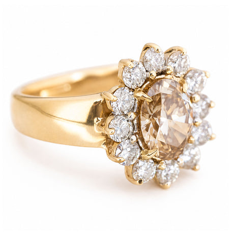 Vintage brown diamond cocktail ring with an oval fancy coloured brown diamond framed by a halo of brilliant-cut diamonds.