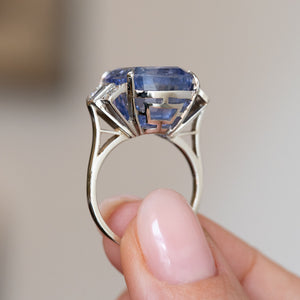 Underside view of the vintage platinum ring, revealing its structured openwork mount and elevated sapphire setting.