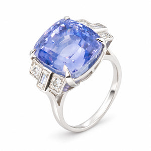 Elevated studio view of the vintage sapphire cocktail ring, showcasing its substantial platinum setting and geometric diamond shoulders.