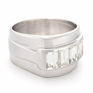 A side profile of a platinum Vintage ring featuring a row of natural baguette-cut diamonds.