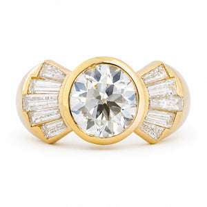 Vintage 1950s old-cut diamond fan engagement ring with bezel-set centre and diamond accents.