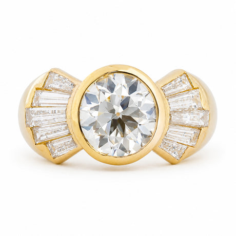 Vintage 1950s old-cut diamond fan engagement ring with bezel-set centre and diamond accents.