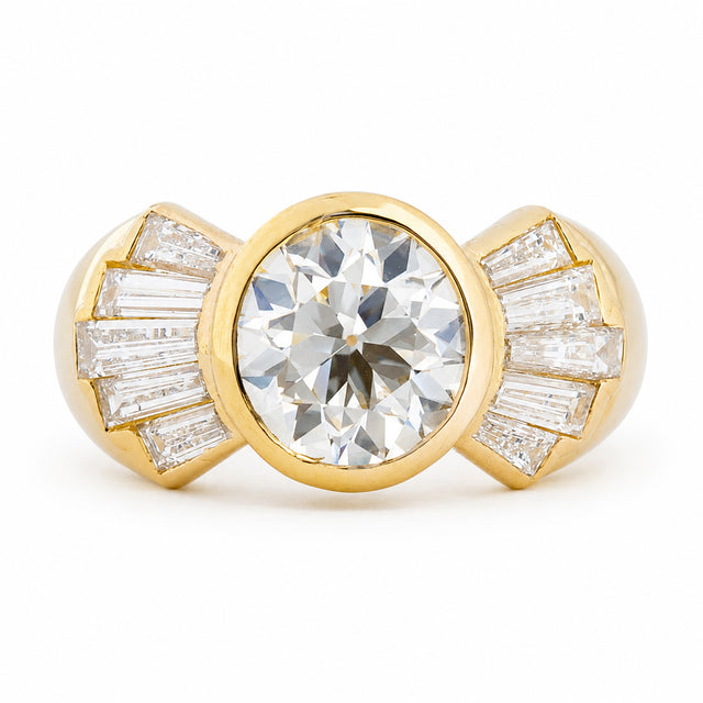 Vintage 1950s old-cut diamond fan engagement ring with bezel-set centre and diamond accents.