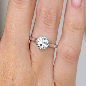 Close-up of the Art Deco engagement ring, featuring a substantial old-cut diamond in a classic claw setting.