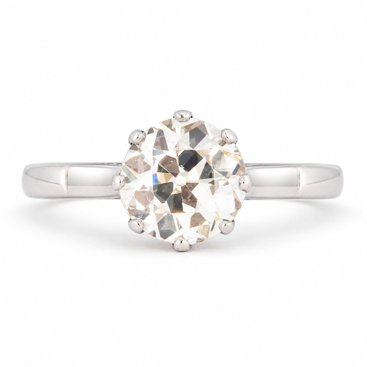 Antique Art Deco warm old-cut diamond solitaire engagement ring, claw set in polished platinum.