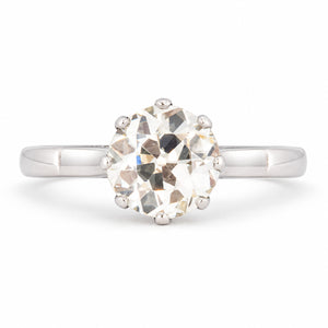 Antique Art Deco warm old-cut diamond solitaire engagement ring, claw set in polished platinum.