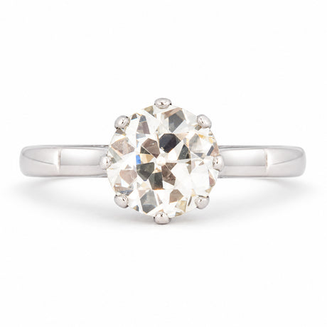 Antique Art Deco warm old-cut diamond solitaire engagement ring, claw set in polished platinum.