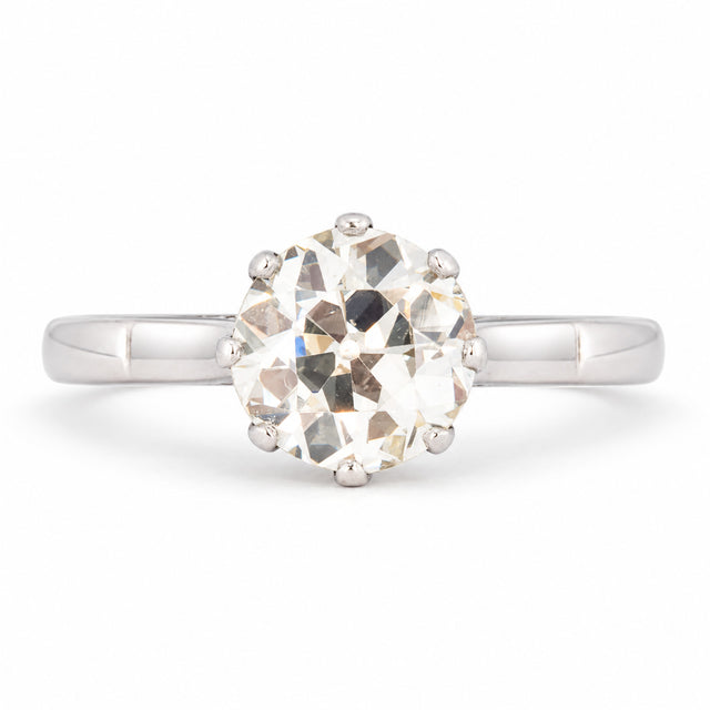 Antique Art Deco warm old-cut diamond solitaire engagement ring, claw set in polished platinum.