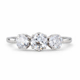 A front profile of an antique, Edwardian old-cut diamond three-stone engagement ring set in platinum.