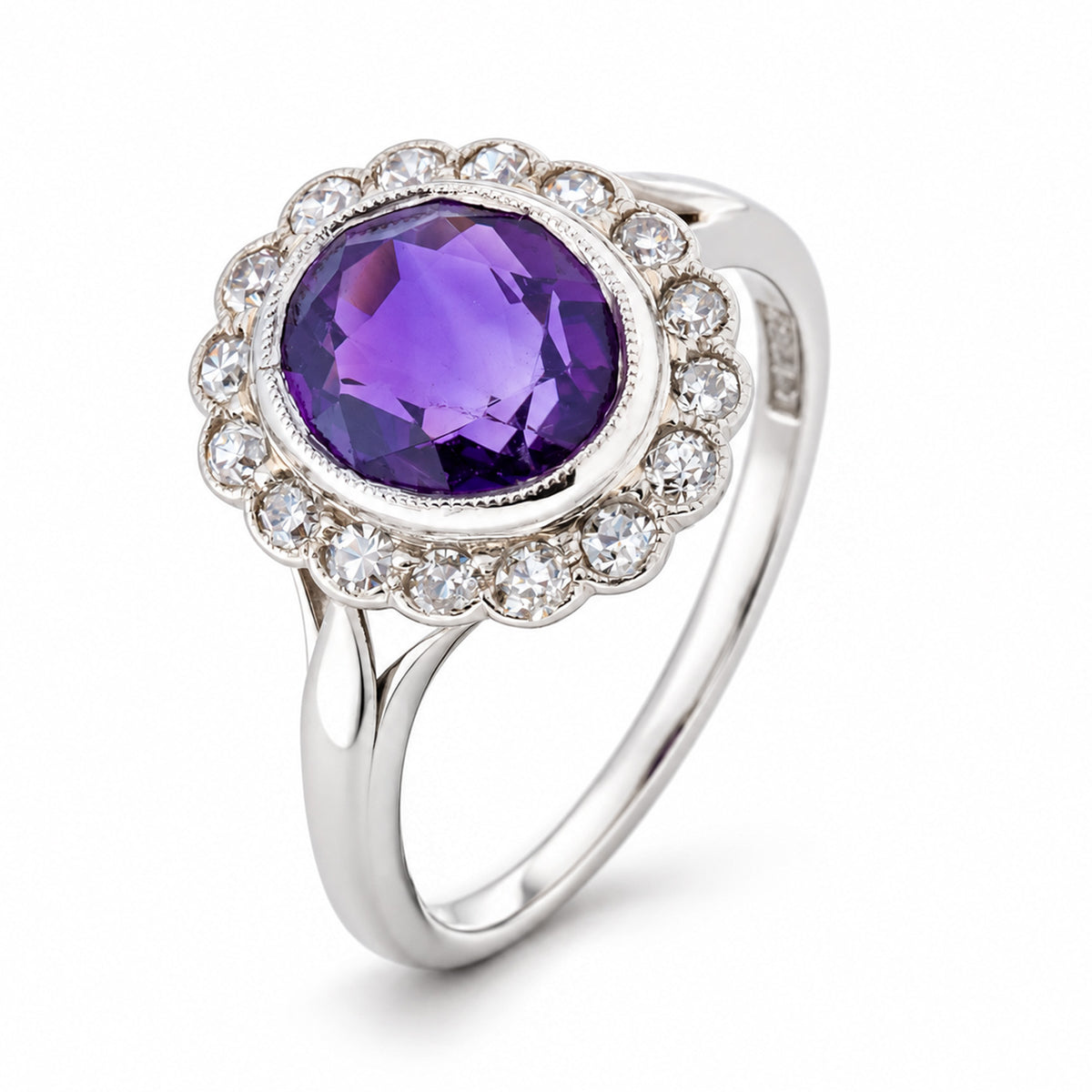 Studio three-quarter view revealing the deep purple amethyst, old-cut diamond halo and elegantly split white gold shoulders.
