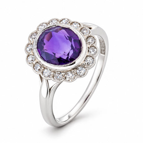 Studio three-quarter view revealing the deep purple amethyst, old-cut diamond halo and elegantly split white gold shoulders.