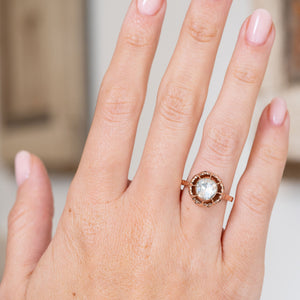 Worn on the hand, this 12ct yellow gold solitaire showcases the statement proportions of its rose-cut diamond and circular setting.