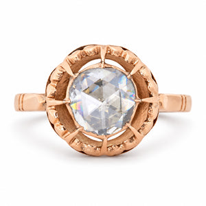 Antique Victorian solitaire ring featuring a large rose-cut diamond in an ornate openwork setting of warm 12ct yellow gold.