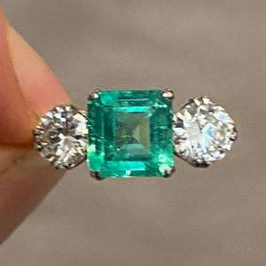 Antique, Art-Deco emerald and diamond three-stone engagement ring
