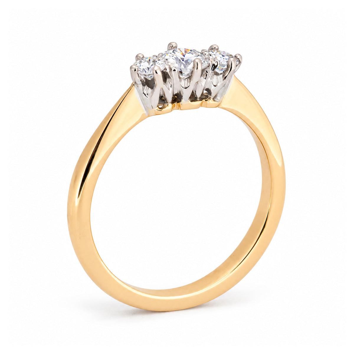 Rear studio view of the Edwardian trilogy ring, revealing the raised platinum claw settings and polished yellow gold shank.