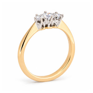 Rear studio view of the Edwardian trilogy ring, revealing the raised platinum claw settings and polished yellow gold shank.