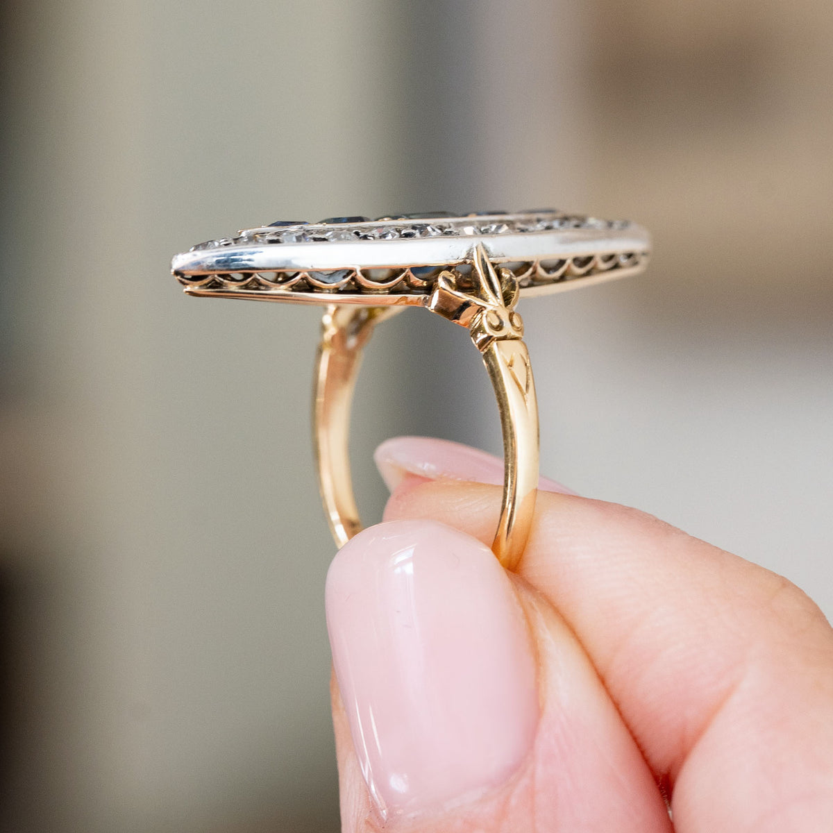 Profile study revealing the slim diamond-set top, pierced gallery and decorative yellow gold shank of the Victorian ring.