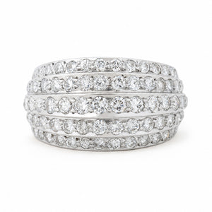 A Vintage, 1950s diamond bombe cocktail ring in white gold against a white background