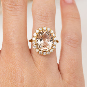 Close-up of the vintage cluster ring, highlighting the softly coloured topaz and bright round diamond surround.