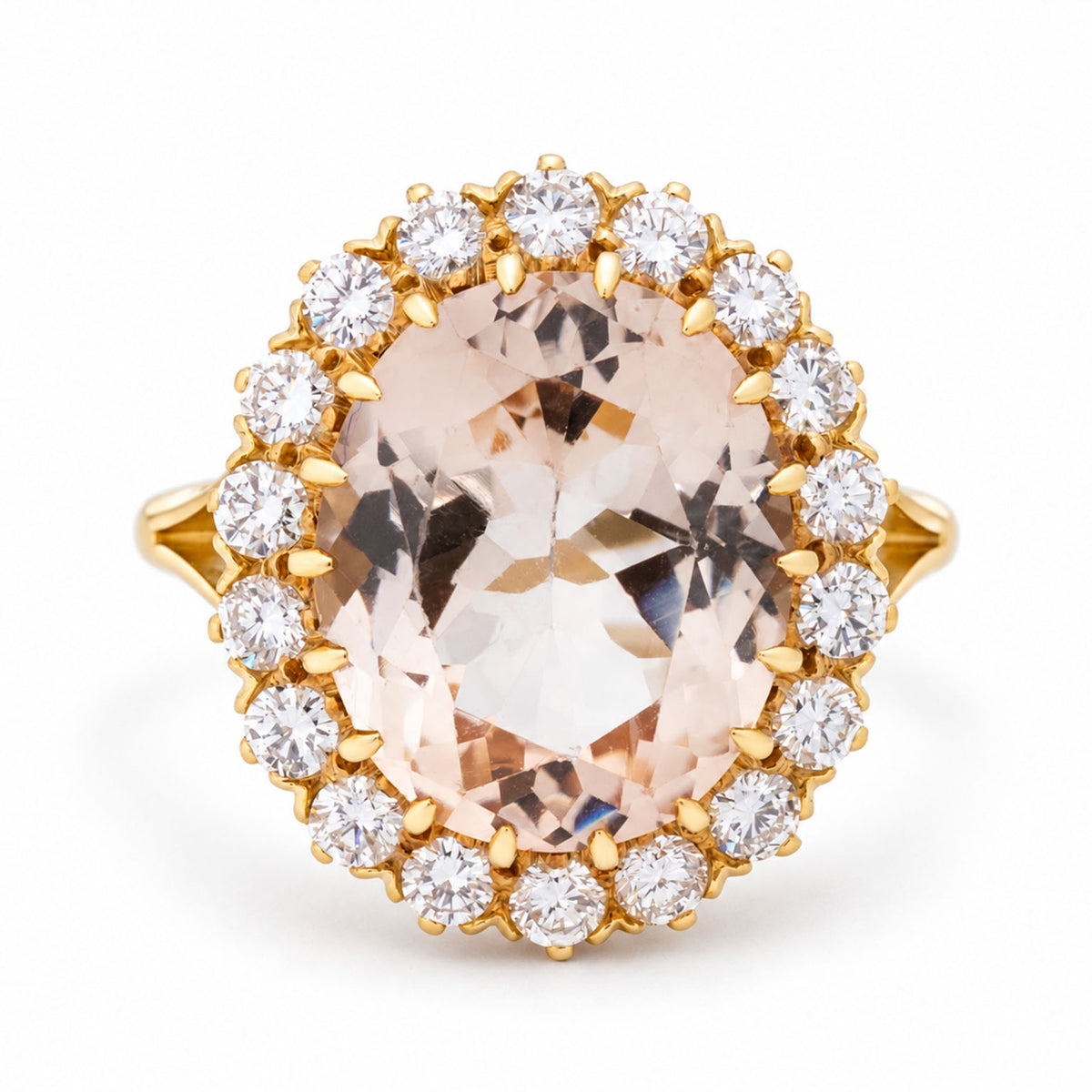 Vintage oval-cut topaz and diamond cluster engagement ring in yellow gold, featuring a pale peach topaz encircled by a sparkling diamond halo.