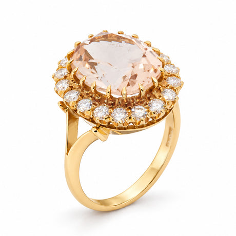 Raised studio view of the vintage topaz ring, revealing its oval centre stone, diamond surround and polished yellow gold band.