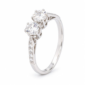 Three-quarter studio portrait of the Art Deco toi et moi ring, revealing the raised twin-diamond setting and slender platinum band.